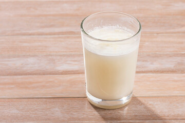Glass of dehydrated milk powder with nutrients