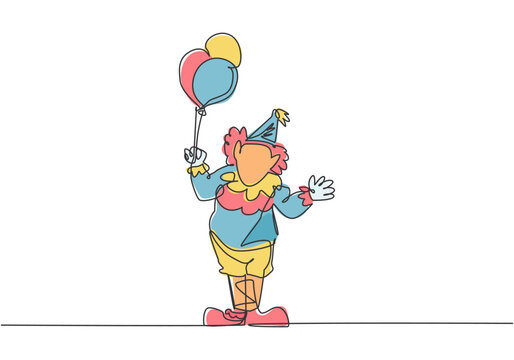 Single continuous line drawing the male clown stands while holding several balloons in his right hand. Children really like the show. Dynamic one line draw graphic design vector illustration.
