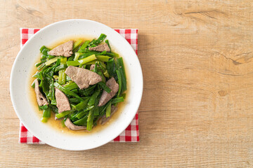 Stir-fried onion flower stem with pork liver