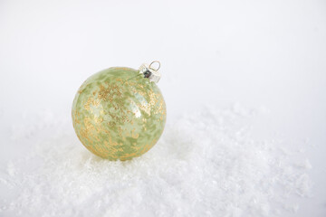 festive christmas ball on white background with snow