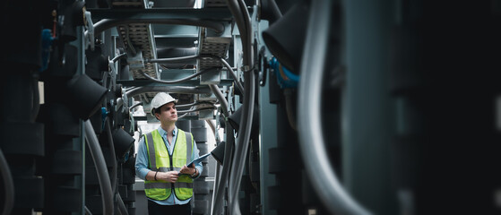 Engineers are inspecting a large building or industrial facility's cooling system for the air...