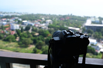 black digital camera shooting city landscape