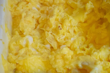 Solf scrambled egg, a close up of American traditional homemade fried scramble eggs breakfast food background.