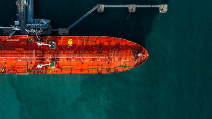 Aerial view oil ship tanker vessel loading and unloading in oil terminal station refinery, Global...
