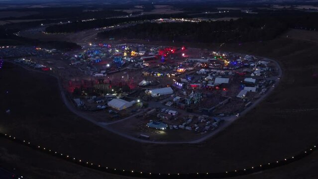 Boomtown festival slow orbit at dusk