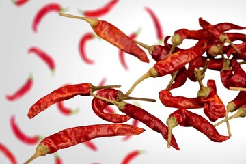 Obraz premium Falling red hot chilli peppers vegetables