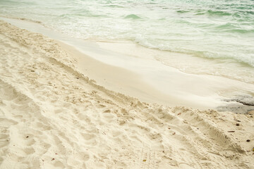 Wave on Sand Background at Coast,Beautiful Texture Wavy white Foam Blue Ocean on Beach Coastline,Sandy with Sea Nature. Transparent Water Seascape Island Photography,Vacation Tropical Summer Backdrop