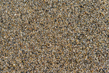Background of coarse sand of Almeria beach, Spain