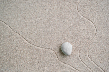 Fototapeta na wymiar Japanese Zen Garden with Pebble with Line on Sand,mini Stone on Beach backgrond Top View and nobody,Ciircle Rock Balance Japan on nature,Simplicity Purity life,Relax Aromatherapy Spa and Yoga,Buddhism