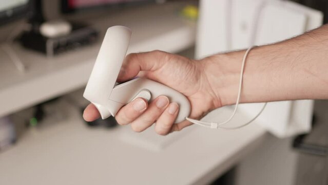 Hand Using a Virtual Reality VR Game Controller Making Gestures