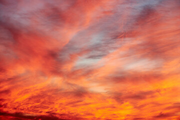 Dramatic orange sunset sky with clouds. Abstract nature backgrounds