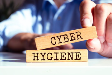 Wooden blocks with words 'Cyber Hygiene'. Business concept