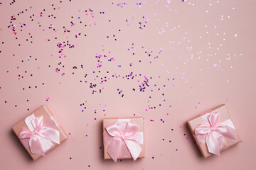 Pink gift boxes over the pink background. 