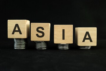 Asian economic recession, crash, collapse, crisis and Asia economy down concept. Wooden blocks in...