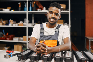 Portrait of african engineer working at factory