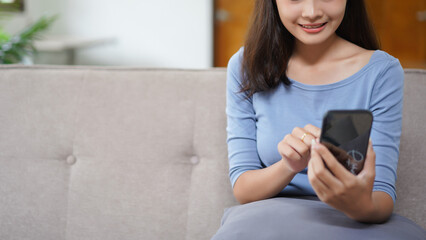 Work from home concept, Business women use smartphone to search data while working remotely at home