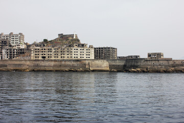 Obraz premium Beautiful sea view of an Island. Hashima Island buildings in Japan.