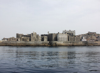 Fototapeta premium Beautiful sea view of an Island. Hashima Island buildings in Japan.