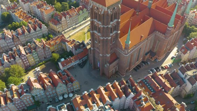Incredible Drone Flight Over St. Mary's Basilica near Colourful Houses. Summer