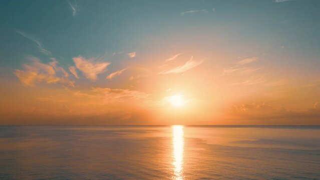 Sun rising above the sea at dawn. Colorful sunrise sky. 4K time-lapse.