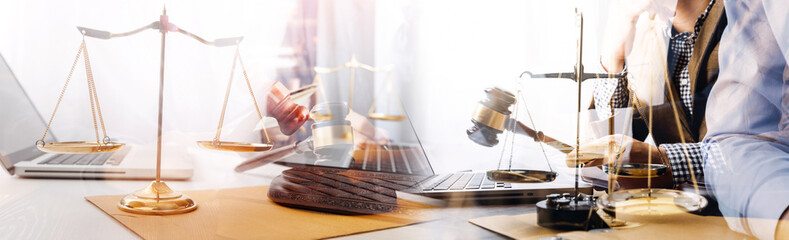 Business and lawyers discussing contract papers with brass scale on desk in office. Law, legal...