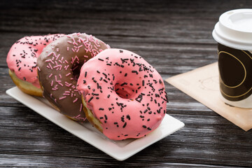 fresh artisan donuts and take away coffee