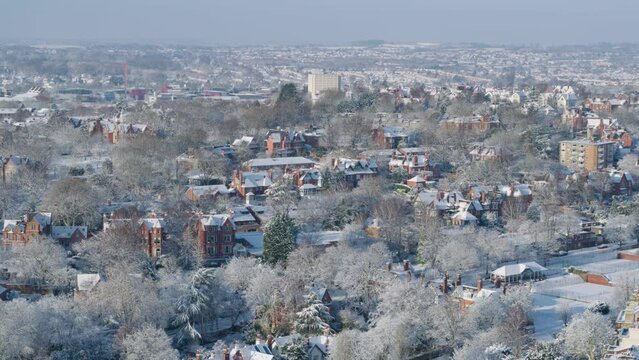 Aerial cinematic drone shot of beautiful red brick houses in nottingham during the winter months