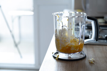 Preparation of healthy food: cottage cheese and egg in a blender. Food sloppy on the table