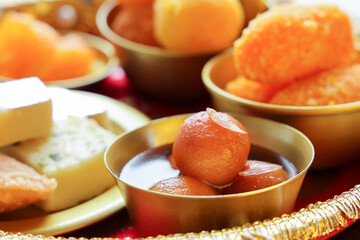 Gulab jamun gulaab jamun sugar syrup golden bowl Indian sweet food mithai Egyptian Zalabia balls...