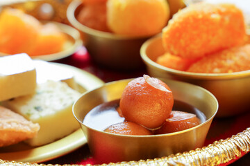Gulab jamun gulaab jamun sugar syrup golden bowl Indian sweet food mithai Egyptian Zalabia balls dessert Diwali sweets Dussehra Holi ganesh chaturthi Ram navmi Ramadan Pakistan India Sri Lanka Kerala