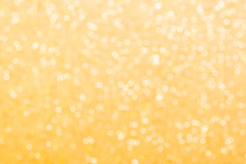 Gold light shiny bokeh abstract blur background with bright round defocus golden pattern
