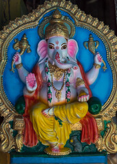 Colorful idol of Elephant God Ganesha from Hindu mythology. Close up, selective focus.  