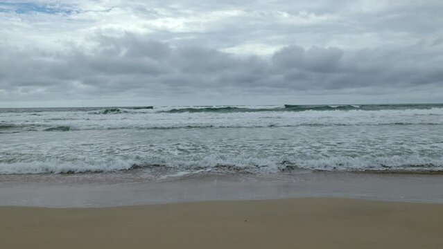 Handheld shot of a beach in Bocas del Toro, Panama, with the waves coming directly to camera