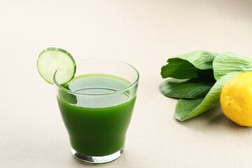 A glass of Green Juice, made from organic pakcoy, cucumber and lemon, very good for health. Cold Pressed Juice
