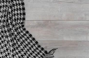 Warm blanket on the background of the laminate. There is a place for your text.