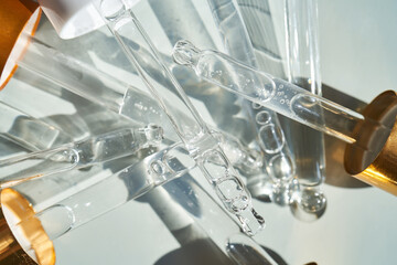 There are a lot of pipettes from cosmetics in one photo.