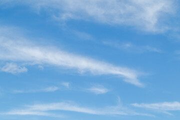 White fluffy clouds in the blue sky. Blue sky background and white clouds soft focus, pastel sky