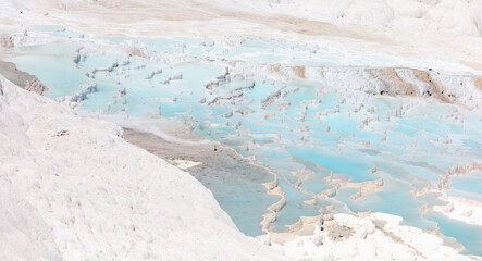 Emerald water in white limestone rock.