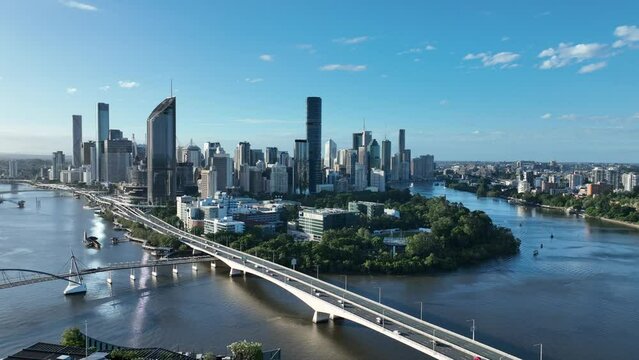 Aerial footage of Brisbane CBD with Expressway Motorway, Captain Cook Bridge in shot, Brisbane CBD with Botanical Gardens and Queensland University of Technology (QUT) in shot.