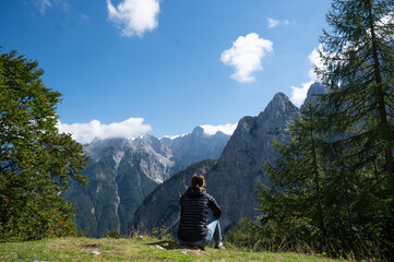 Woman enjoying the mountains view in Slovenia alps