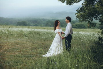 Beautiful wedding couple in nature. Wedding. Bride and groom on their wedding day. High quality photo