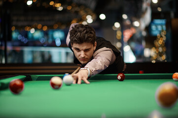 Portrait of man playing billiard