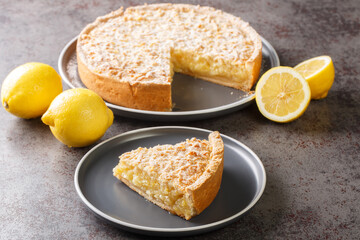 Grated cake Lemon curd pie close-up in a plate on the table. Horizontal