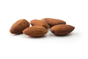Almonds isolated on white with natural shadow.