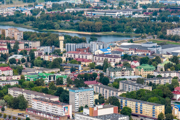 Fototapeta na wymiar aerial panoramic view from a great height of a small provincial town with a private sector and high-rise apartment buildings