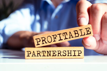 Wooden blocks with words 'Profitable Partnership'. Business concept