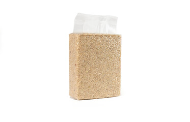 Fototapeta na wymiar Brown rice in transparent plastic vacuum sealed bag