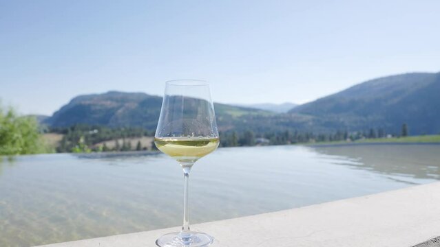 White wine glass, wine tasting, sunshine, vineyard, chardonnay, Okanagan wine, hotel. 4K 24FPS.