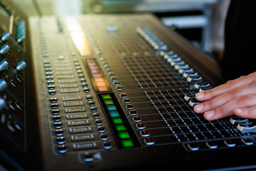 professional audio mixer with operator hand