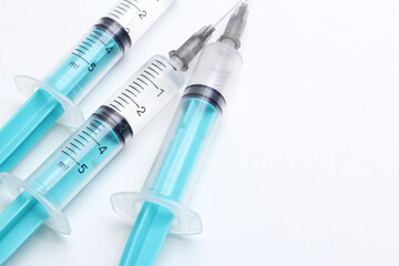 Medical syringe on a white background. A syringe for injection. The concept of health and beauty